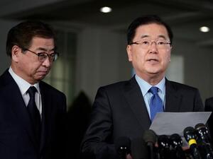 South Korean National Security Advisor Chung Eui-yong, right, briefs reporters outside the West Wing of the White House in Washington. (AFP/ File)