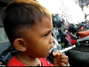 Two-year-old Rapi Ananda Pamungkas, from Sukabumi, Indonesia, (pictured) puffs through 40 cigarettes a day. (Social Media)