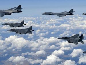 South Korean Defence Ministry handout photo shows USAF B-1B Lancer bombers (L), US F-35B stealth jet fighters (far R) and S. Korean F-15K fighter jets (foreground) over South Korea. (AFP/ File Photo)