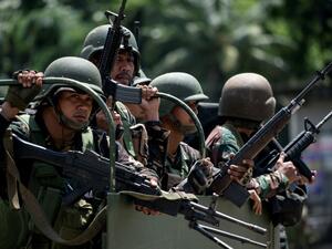 NOEL CELIS / AFP

NOEL CELIS / AFP

(NoelSoldiers aboard their vehicles maneouver through a street in Marawi, in southern island of Mindanao on June 10, 2017. United States special forces are providing support to the Philippine military battling to dislodge Islamist militants in a southern city, the US embassy said, as 13 Filipino marines were killed in fresh fighting. Celis/AFP)
