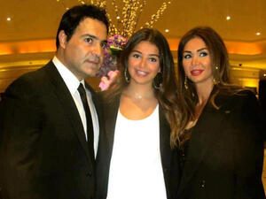 Assi with his daughter Marita (M) and wife Colette (R). (File photo)