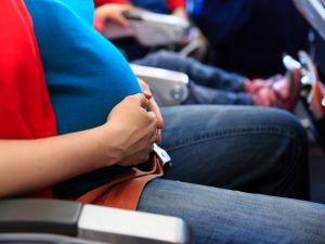 The mother-to-be was traveling home from Abu Dhabi, when the plane was diverted to Bahrain and she unexpectedly went into labor on the flight. (Shutterstock)