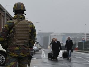 A Belgian soldier controls access to Brussels airport on March 23, 2016, one day after two massive suicide blasts by men with bombs in their bags hit the airport. (AFP/John Thys) 