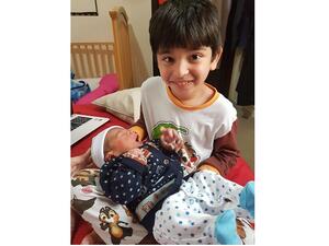 Big brother Saad and baby Fahad, five years apart, are pictured together at home. Their mother says she understands why some women struggle with breastfeeding.