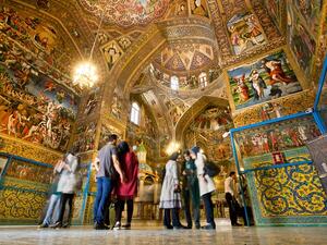 Tourists stand inside the Armenian Cathedral in Isfahan on October 15, 2014. The Cathedral, also known as the Church of the Saintly Sisters, was built in 1664. (Shutterstock)  