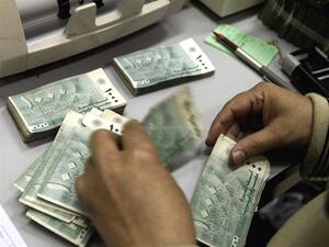 Salaries can play a huge role in assessing job satisfaction. (File photo)