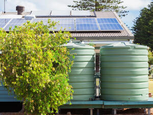 Solar panels and rainwater tanks lessen the impact on the environment. (Shutterstock)  Solar panels and rainwater tanks lessen the impact on the environment. (Shutterstock)