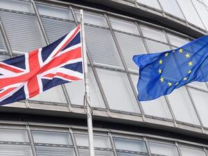 This file photo shows The British Union flag (L) and the European Union (EU) flag flying side-by-side outside City Hall, the headquarters of the Greater London Authority, in central London. (AFP/File)