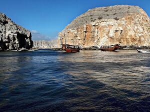 Dhows carrying tourists cruise off the Oman's Khasab shores along the Strait of Hormuz. (AFP/File)