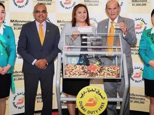 Officials at Dubai Duty Free supervise the latest draw for its millionaire promotion. (KhT)