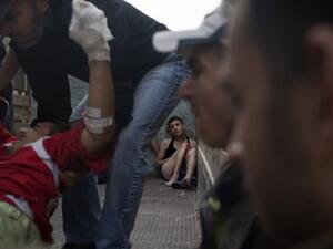 A young Syrian injured in an attack by regime forces waits to be taken to hospital, October 21, 2012, in Aleppo. (AFP/Fabio Bucciarelli)