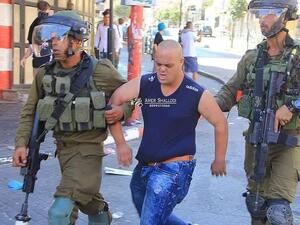 Israeli occupation soldiers arrested and assaulted a Palestinian youth with down syndrome (Twitter)