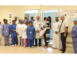 Khalid Al Jalham, Director of the Ambulatory Care Center with two-year-old Amanuel Endale and the Anesthesia and ENT team. 
