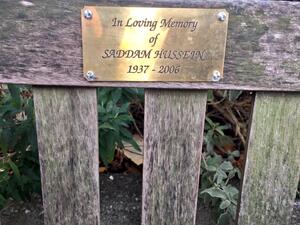 Photo shared by @nakedvix on Twitter of the bench that had a bronze plaque in commemoration of Saddam Hussein.