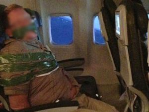 A passenger bound with tape allegedly aboard an Iceland Air flight from Reykjavik to New York. (Twitter)