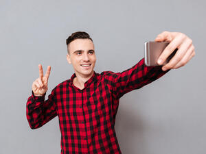 Researchers found the best results came from photographs of people flashing the peace sign. (Shutterstock)