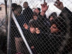 Refugees wait to enter Macedonia and from there make their way into Western Europe along the so-called Balkan route. (AFP/Louisa Gouliamaki)