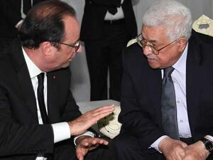 أولاند يشيد بمشاركة عباس في جنازة بيريز 
