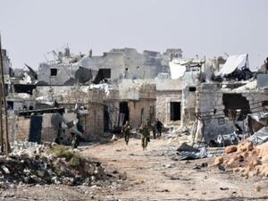 قوات موالية للحكومة السورية في محيط بلدة منيان غرب حلب بعد استعادة السيطرة عليها من فصائل مقاتلة
