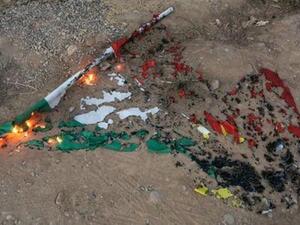 علم كردي محروق في كركوك
