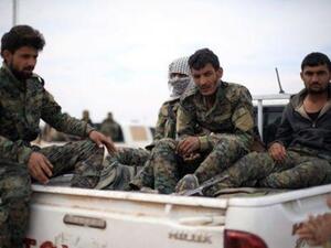 مقاتلون من قوات سوريا الديمقراطية في دير الزور
