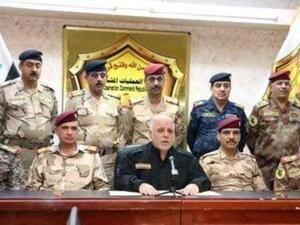 رئيس الوزراء العراقي حيدر العبادي (في المنتصف) يعلن عبر التلفزيون العراقي انطلاق الحملة على الموصل يوم 16 

