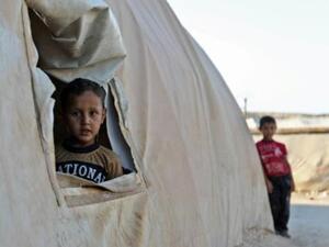 طفل في مخيم نازحين قرب الحدود التركية في محافظة ادلب

