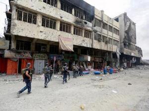 أفراد من الشرطة الاتحادية العراقية خلال قتال ضد متشددي تنظيم الدولة الإسلامية في المدينة القديمة بالموصل
