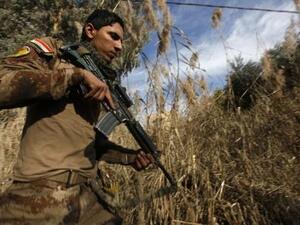 أحد أفراد قوات جهاز مكافحة الإرهاب العراقي في حي الأندلس في الموصل
