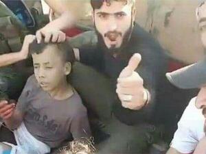 مشهد من فيديو يظهر الطفل الفلسطيني قبل ذبحه