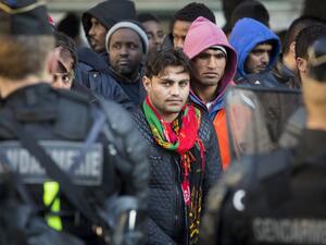 Migrants are evacuated by French police officers and gendarmes from a makeshift camp under the Stalingrad metro station in Paris, on May 2, 2016. (AFP/Geoffroy Van der Hasselt)