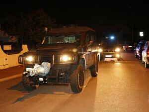 A French special forces RAID vehicle leaves after an assault on June 14, 2016 in Magnanville, 45 kms west of Paris following a police operation late Monday, hours after a man had stabbed a police officer to death. (AFP/Matthieu Alexandre)