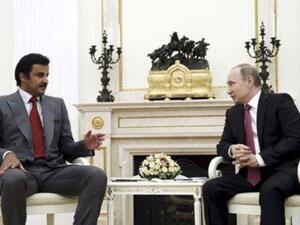 ارشيف/الرئيس الروسي فلاديمير بوتين (الى اليمين) وأمير قطر الشيخ تميم بن حمد آل ثاني
