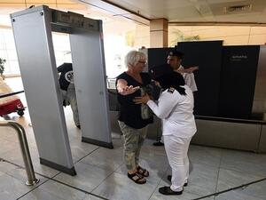 A tourist passes through the security check at Sharm El Sheikh Airport. (AFP/File)