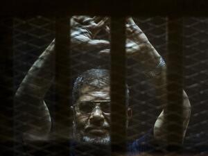 Mohamed Morsi is currently serving out three lengthy jail terms on charges of "killing protesters" and "spying for Qatar." (AFP/File)