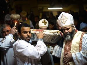 Egyptian Coptic Christian religious leaders celebrate Christmas in the monastery of Saint Samaan in Cairo on January 6, 2015. (AFP/File)