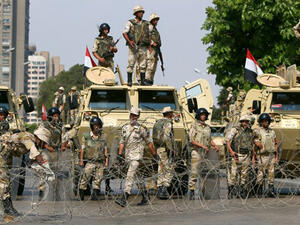 Egyptian army soldiers block Salah Salem highway to prevent supporters of the Muslim Brotherhood and ousted Egyptian president Mohamed Morsi from crossing during their demonstration in Cairo, on July 19, 2013.
(AFP/Marwan Naamani)