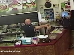 CCTV footage released by local police shows kebab shop owner Said Ahmed keeping his cool in front of an armed robber. (YouTube)