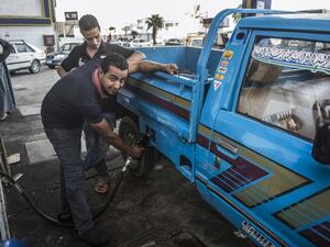 An Egyptian petrol station worker fills up a pickup truck's tank in the capital Cairo on June 29, 2017. Egypt announced a new sharp increase in fuel prices on June 29, 2017 as it slashed government subsidies in a tough IMF-backed reform program. (Khaled Desouki/AFP)