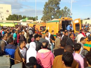 Egyptians gather around ambulances following a gun and bombing attack on the Rawda mosque near the North Sinai provincial capital of El-Arish on November 24, 2017 (AFP)