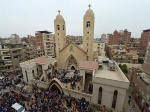 People gather outside the Mar Girgis Coptic Church in Tanta after a bomb blast. (AFP/ File Photo)