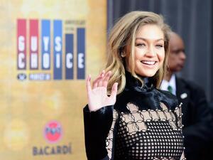 Gigi follows in the footsteps of stars including Chrissy Teigen, Kate Upton and Emily Ratajkowski in picking up the award. (AFP/Frazer Harrison)