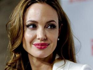 Bold, beautiful, and hard bent on helping Syria, Angelina Jolia stands up to the podium.  (Image from archives)