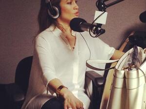 Jennifer Lopez talking on the mic (Photo courtesy of Facebook)