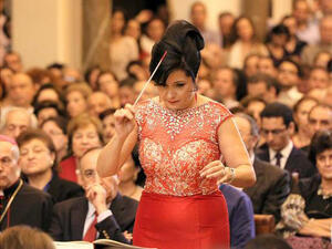 Joana Nachef conducts and looks good doing it. Why not? (Image courtesy of now.mmedia.me)