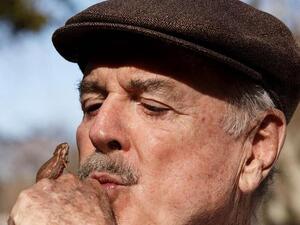 John Cleese the comic with a "stand-up chameleon" in South Africa (Image: Twitter)