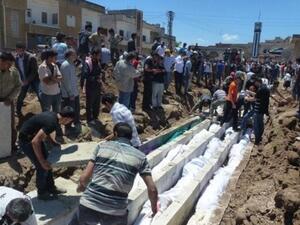 Mass burial at Houla, Syria Mass burial at Houla, Syria