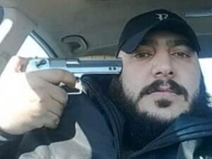 One member of the Shabiha posing with his gun - source The Daily Mail 