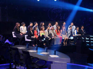The remaining 19 Arab Idol contestants sit on pins and needles