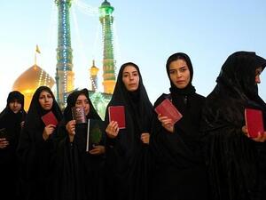 Iranian women are barred from showing their hair—though not everyone's very strict about it. (AFP)